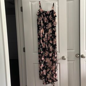 Lily Rose. Black floral romper with high low skirt. Size M.